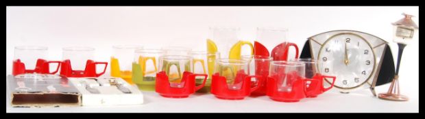 A collection of vintage retro 20th Century glass Pyrex drinking cups and mugs, each glass liner with