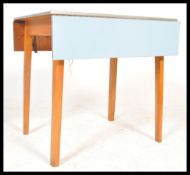 A vintage Retro 1950's / 1960's mid 20th century blue formica drop leaf Kitchen dining table, raised