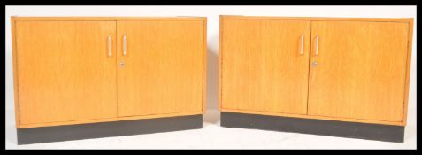 A pair of retro 20th Century beech wood low Industrial school twin door cabinet / sideboard /