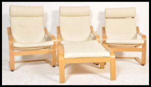A set of three contemporary Ikea poang bentwood chairs / armchairs being upholstered loose