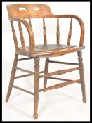 A Victorian bentwood spindle rail back Industrial oak office desk chair - armchair being raised on