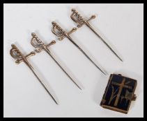 An early 20th Century miniature portrait book having blue enamel cover with Ecclesiastical cross