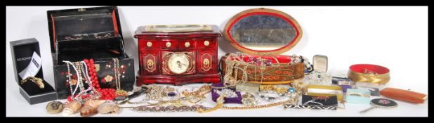 A large collection of vintage costume jewellery to include various brooches, silver jewellery,