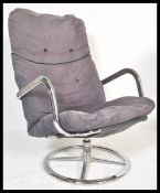 A 20th century retro vintage swivel / lounge chair armchair comprising of a polished metal frame