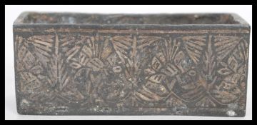 A 19th Century Japanese Meiji period bronze miniature bonsai planter of long rectangular form having