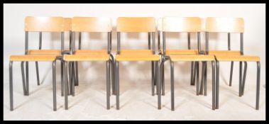 A set of ten 20th Century vintage industrial stacking ( dining )  chairs constructed from beech