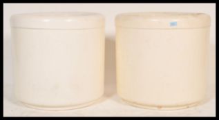 A pair of retro 20th Century designer fibreglass garden planters, the large white twin walled