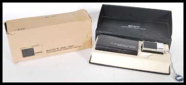 A vintage retro 20th Century Sony ICR-120 miniature Integrated Circuit Radio complete in original
