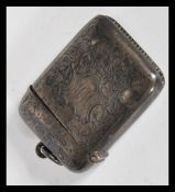 An early 20th Century hallmarked silver Edwardian vesta march case having engraved Armorial