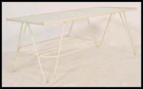 A vintage 20th Century retro Sputnik Atomic two tier coffee table having a glass table top wire