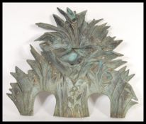 A early 20th Century Art Nouveau cast metal fountain front in the form of reids and water lilies,