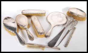 A collection of Victorian and later hallmarked silver ladies vanity dressing table items to