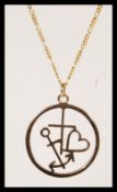 A 9ct gold ladies necklace pendant and chain being hallmarked to the pendant. The pendant with