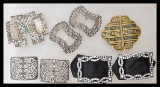 A selection of vintage Art Deco style belt buckles being set with white stones. 10 pieces in total.