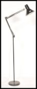 A retro 20th Century floor standing oversized anglepoise style standard lamp, raised on a circular