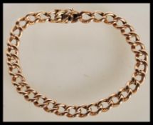 A 9ct gold curb link bracelet with a open box clasp. Bracelet unmarked but tests as 9ct. Weight 11.
