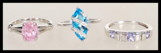 Three 9ct white gold rings to include a white gold ring set with a blue marquise cut stone stone (