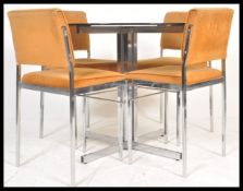 A vintage 20th Century retro chrome and glass dining table and chairs suite.The table raised on x