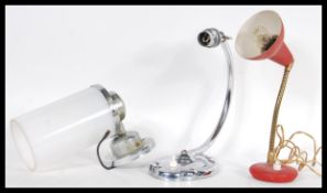 A group of three vintage retro 20th Century desk lamps / lights to include a chrome example, red