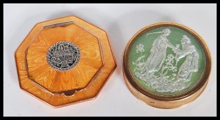 A vintage early 20th Century Art Deco powder mirror compact by Dubarry of circular form having green