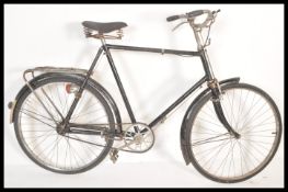 A vintage early 20th Century gents sit up and beg bike from The Hercules Cycle & Motor Co Ltd.