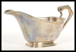 An early 20th Century hallmarked silver gravy sauce boat / milk creamer jug by Northern Goldsmiths