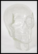 A retro 20th Century clear crackle glass skull head having moulded features with crackle design.