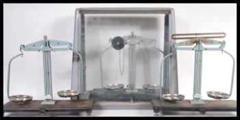 Three sets of vintage 20th Century Griffin and George chemists laboratory scales, one being cased.