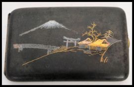 An early 20th Century Japanese Taisho period mixed metal damascene cigarette or cheroot case in