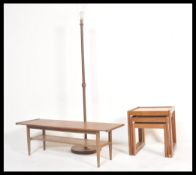 A group of vintage retro 20th Century Danish influence teak furniture to include a surfboard top
