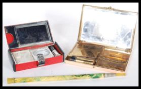 A selection of 1920's Art Deco items to include an telescopic cheroot holder having a marbled handle