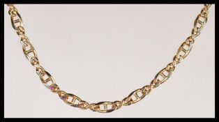 A hallmarked 9ct gold Italian curb link necklace chain having a lobster claw clasp. Weighs 18.6