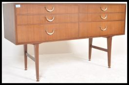 A vintage retro 20th Century teak wood sideboard of Danish influence having six drawers with brass