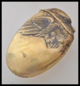 A brass vesta case in the form of a duck, having a match striker to the base, and a hinged lid to