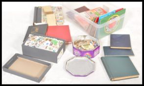 A large collection of stamps dating from the 19th Century to include Victorian penny red example.