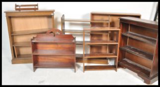 A collection of open bookcases to include an early 20th Century Edwardian oak example with column