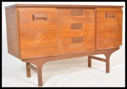 A vintage retro 20th Century teak wood sideboard of small proportions having central bank of three