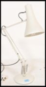 A vintage 20th Century Herbert Terry desk lamp, raised on a circular base and fitted with conical