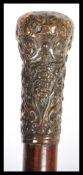 A 19th Century Victorian walking stick cane having a tapering malacca shaft with bronze knob