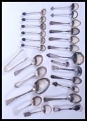 A large collection of hallmarked silver spoons and flatware to include large silver Georgian serving
