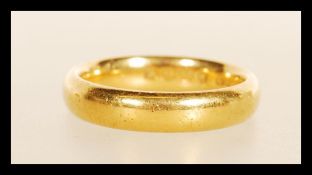 A hallmarked 22ct gold band ring. Hallmarked Birmingham 1924. Weight 6.2g. Size L.5.