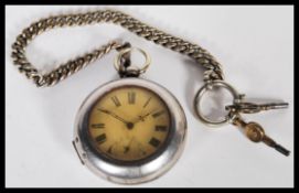 An early 20th Century silver white metal pocket watch having a white enamelled dial with roman