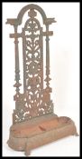 A 19th Century Victorian Coalbrookdale cast iron stick or umbrella stand having tray to lower