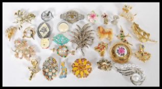 A large collection of vintage costume jewellery brooches ro include Art Deco, Marcasite, gilt,