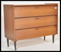A retro vintage 20th Century teak wood Danish influence chest of drawers, having a run of three