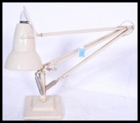 A vintage retro 20th Century Industrial Herbert Terry Anglepoise desk lamp raised on stepped
