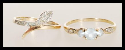 Two 20th Century 9ct gold rings to include a ring set with three white stones and accent stones to