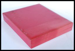 A large vintage designer Cartier jewellery box having a leatherette exterior with gilt edging and