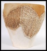 An African tribal drum or large proportions with leather hide and hair decoration to the circular