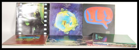 A collection of vinyl Long Play LP records all performed by Yes to include Going For One, Relayer,